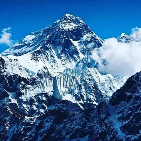 The view of Everest from Kala Patthar: Everest from Kala Patthar. The summit pyramid of Everest above snow-fluted ridges, seen from Kala Patthar. The summit pyramid of Everest above snow-fluted ridges, seen from Kala Patthar
